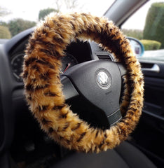 Crazy for Cheetah handmade fuzzy steering wheel cover made from soft faux fur, shown on a car steering wheel.