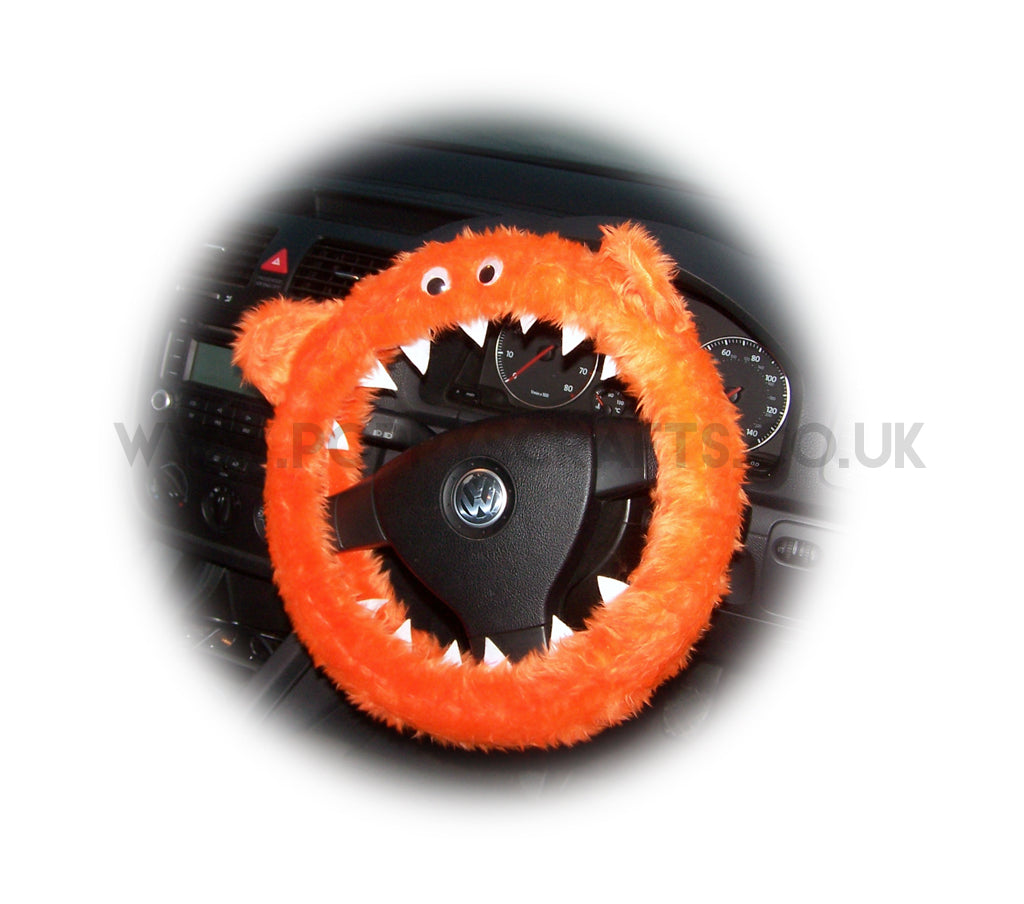Fuzzy faux fur Tangerine Orange Monster steering wheel cover with googly eyes, ears, and teeth. fluffy furry car fun Poppys Crafts